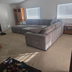 Playground gray armless sofa with pull out