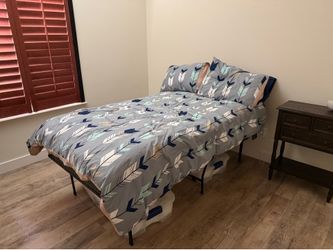 Twin mattress, frame, and blanket
