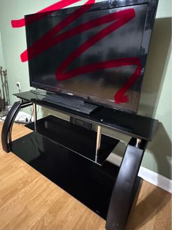 Used Black Glass TV Stand with minor scrapes