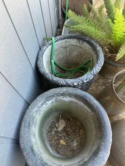 Three large concrete pots