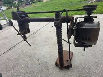 vintage tool is an American Machine & Tool Co. (AMT) Radial Arm Drill Press,