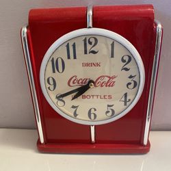 Vintage Coca-Cola drinking bottles red table clock