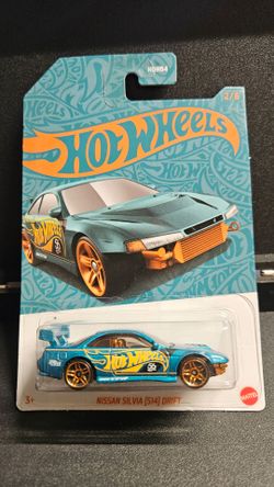Hot Wheels Metallic Teal Nissan Silvia (S14) Drift  package slightly damaged in storage