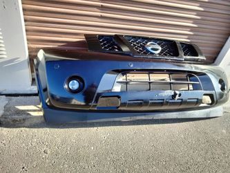 2008-2015 Nissan Armada complete front bumper with all the accessories OEM.