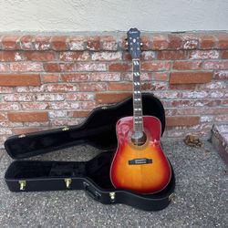 Epiphone Hummingbird Acoustic Guitar With Hardshell Case.