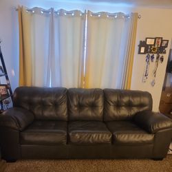 RARELY USED GREY LEATHER SOFA AND LOVE SEAT