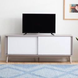 Like-New Modern TV Stand with Sliding Doors and Cable Management