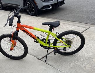 Nishiki green and orange bike