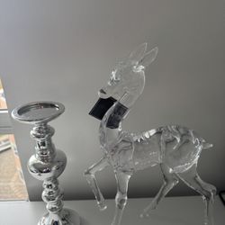 Christmas reindeer, 19 inches tall, and a candle holder (plastic), all for $15.