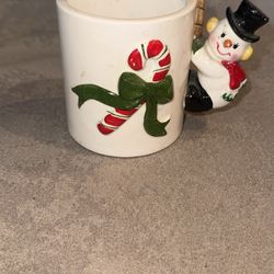 vintage ceramic mug with a snowman handle