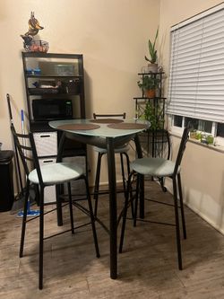 Bar height glass top table