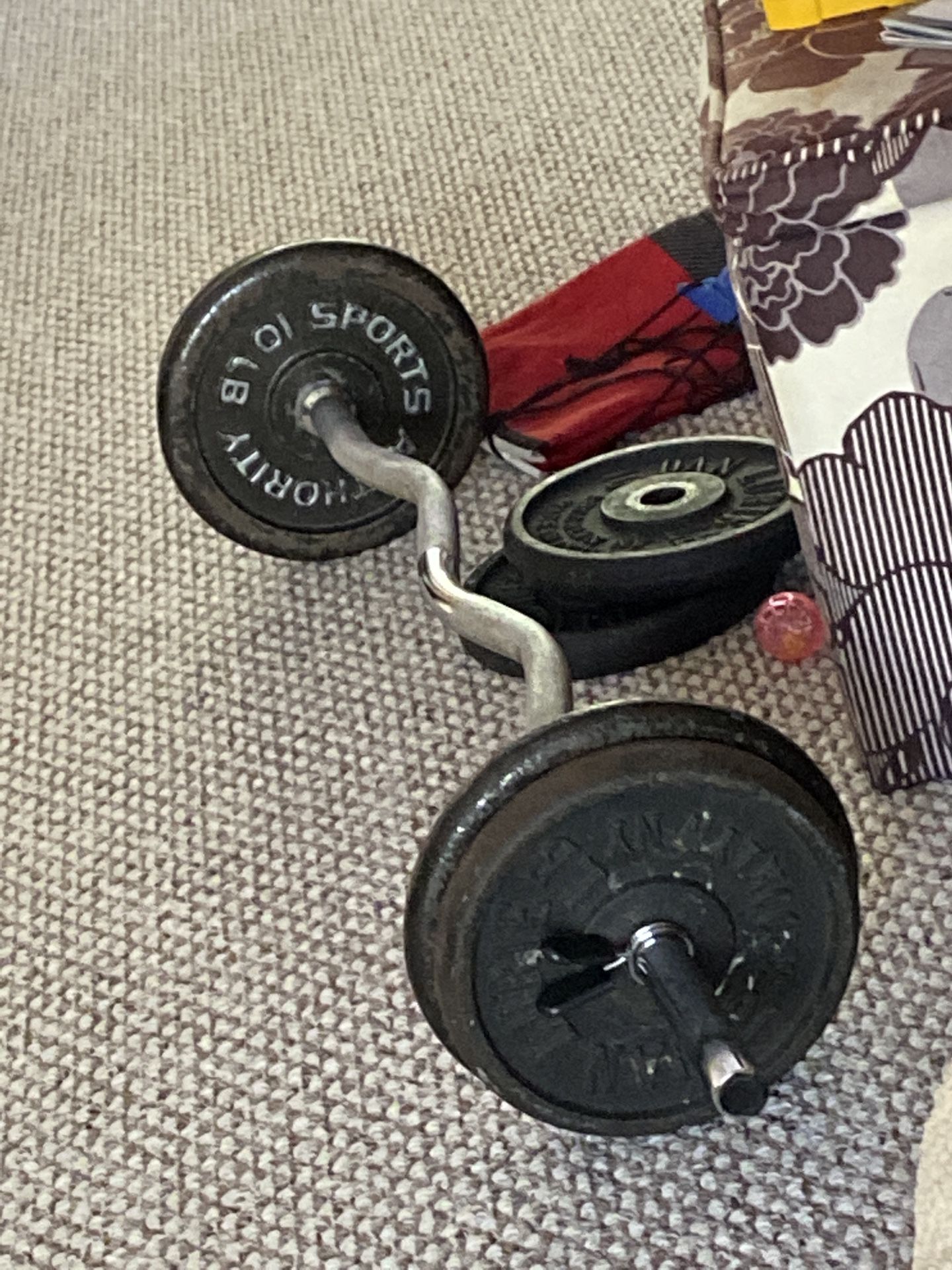 Curl bar with 80lbs of plates
