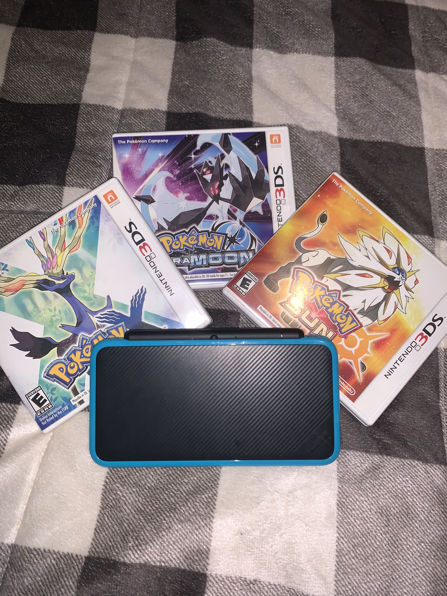 Nintendo 2DS XL with games and charger