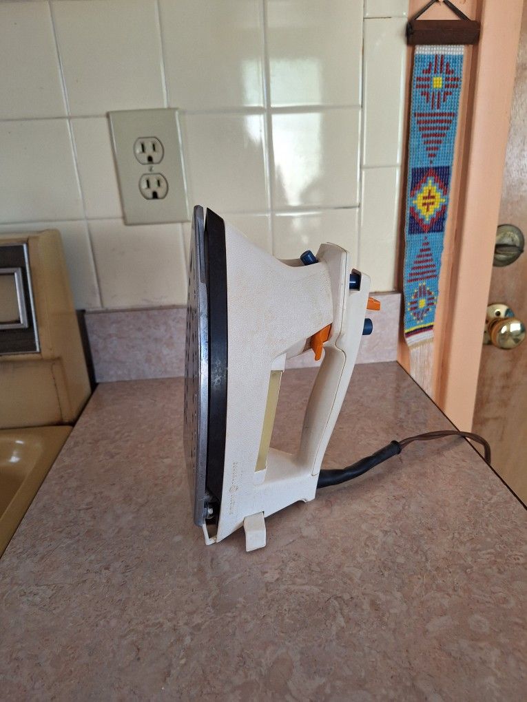 GE Iron and an Ironing Board