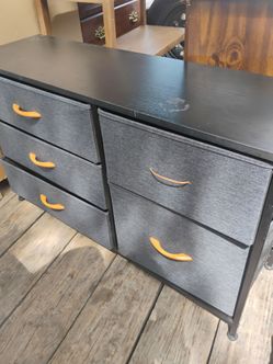 Small foldable gray dresser,comes with 5 drawers clean,top is wood.