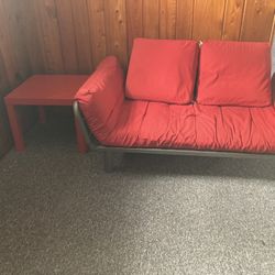 Red Futon And Side Table 
