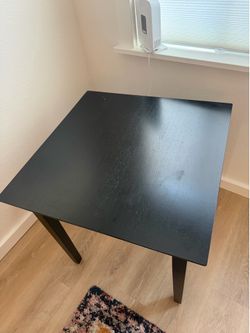 Small black wood grain table
