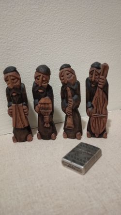 Hand carved figurines with instruments