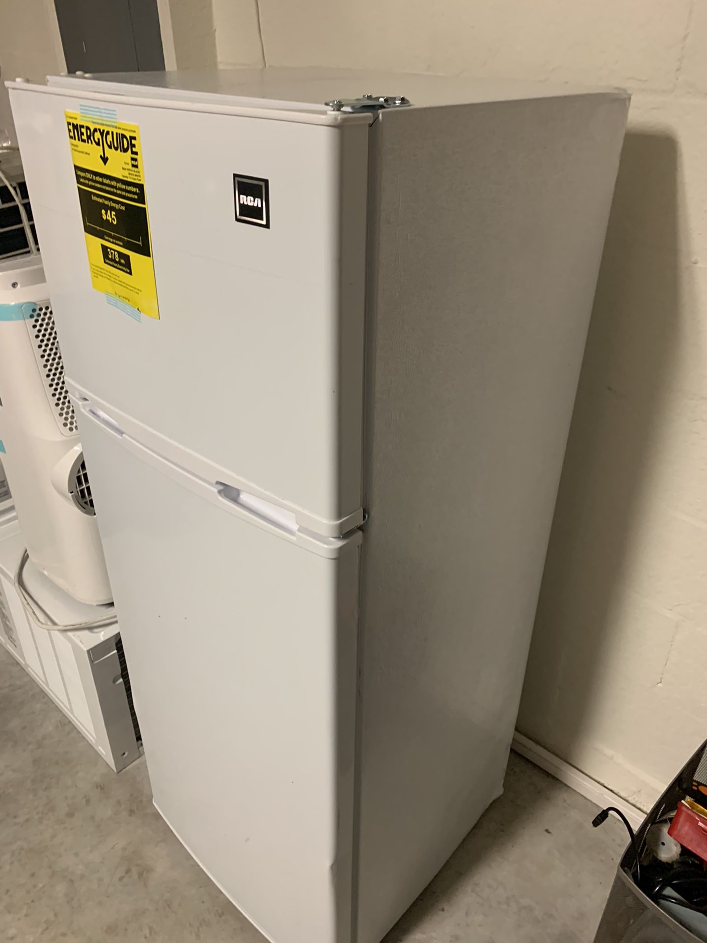 Rca refrigerator 2 door like new only have small dent size 4 f the high x 21.1/2” inch