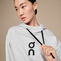 On Men's Club Hoodie in white, made from a blend of organic cotton and recycled polyester. 