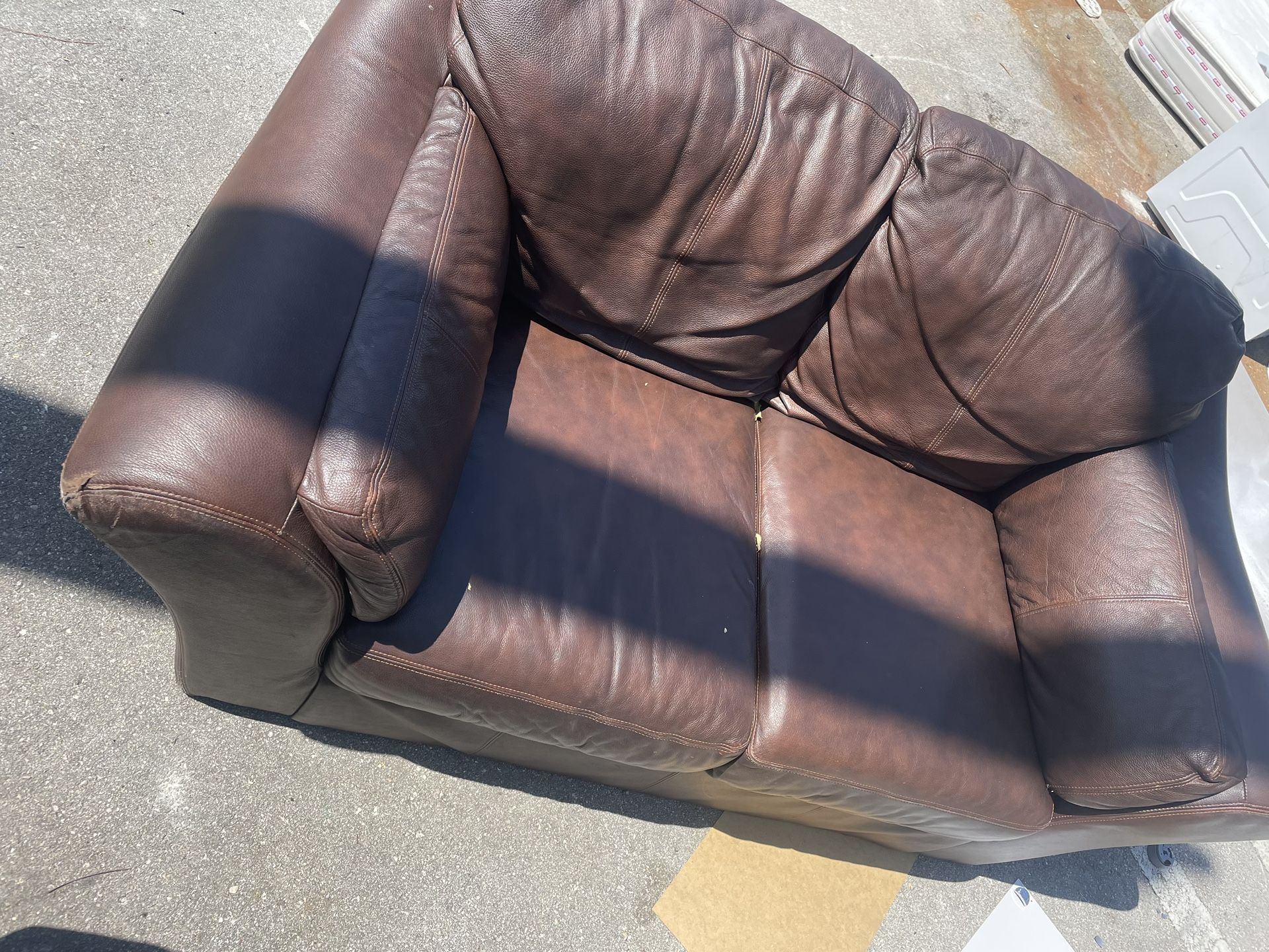 Brown Legitimate Leather Loveseat.