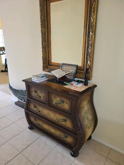 vanity with gold mirror
