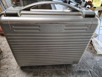 Briefcase heavy duty plastic with inserts, straps and pouch.