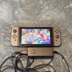 Nintendo Switch Console system with Charger only. No Games