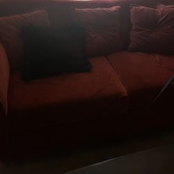 Red cushion sofa with pillows