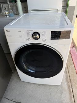 Two washers and dryer sets and stove and 3 door fridge