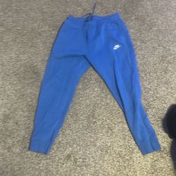 Blue Nike Joggers Size L can fit A Medium 