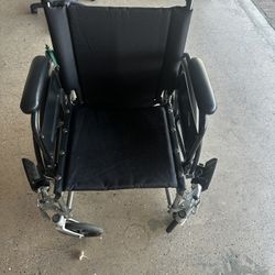 Wheelchair With Adjustable Arms
