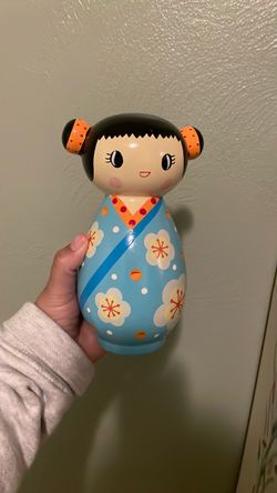 Wooden doll piggy bank