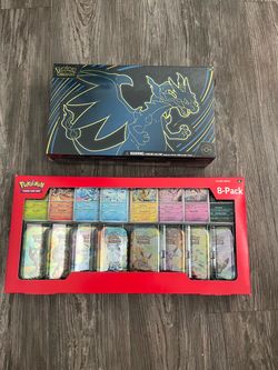 Pokemon Prismatic Tins 8-Pack & Mega Charizard Box