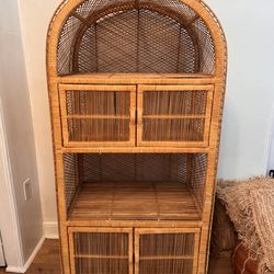 Arched wicker cabinet