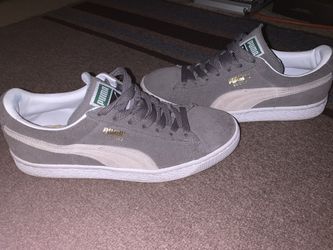 Gray suede pumas