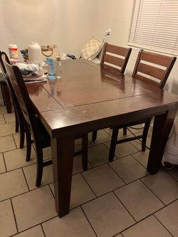 table and 4 chairs it wood table have little small  scratches only