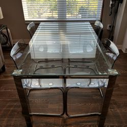 Glass dining table set with chairs