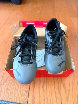 Puma black castle rock cleats kids size 2.5