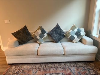 Cream couch with built in sleeper