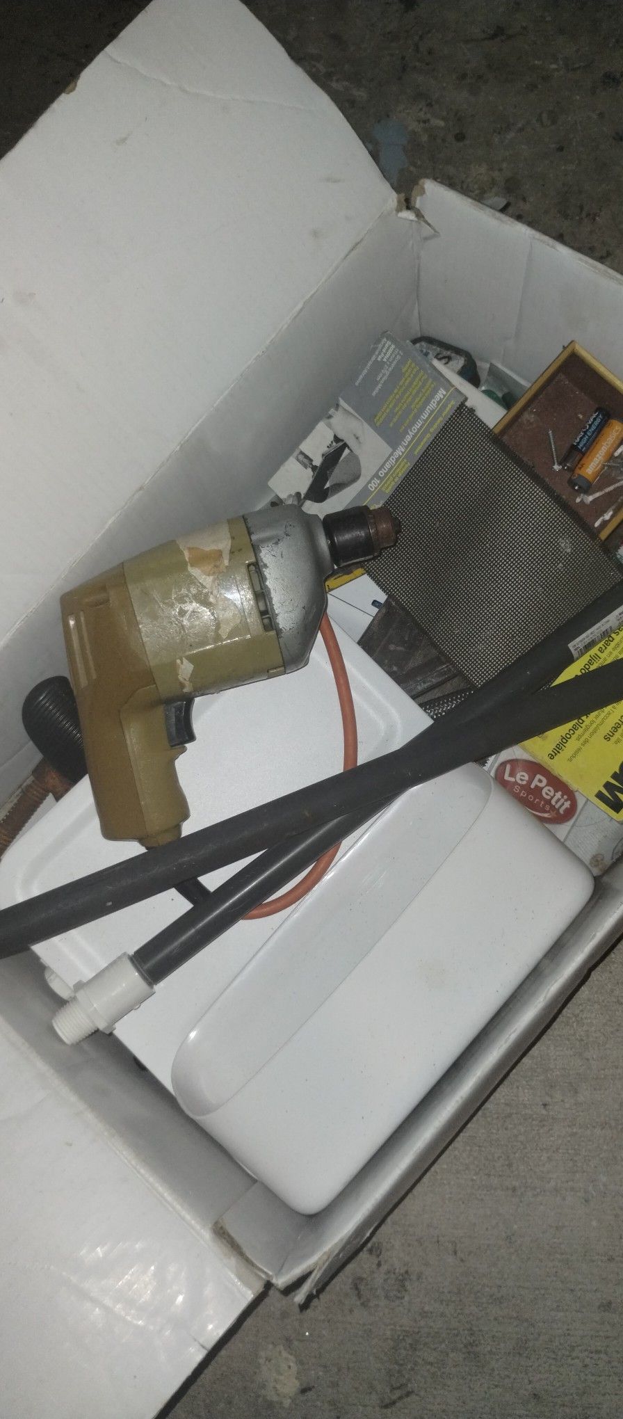 Drill With A Box Of Tools