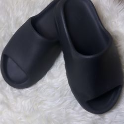 black yeezy slides. 