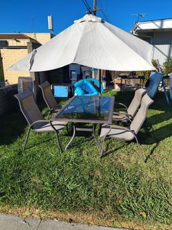Glass patio table with 4 chairs