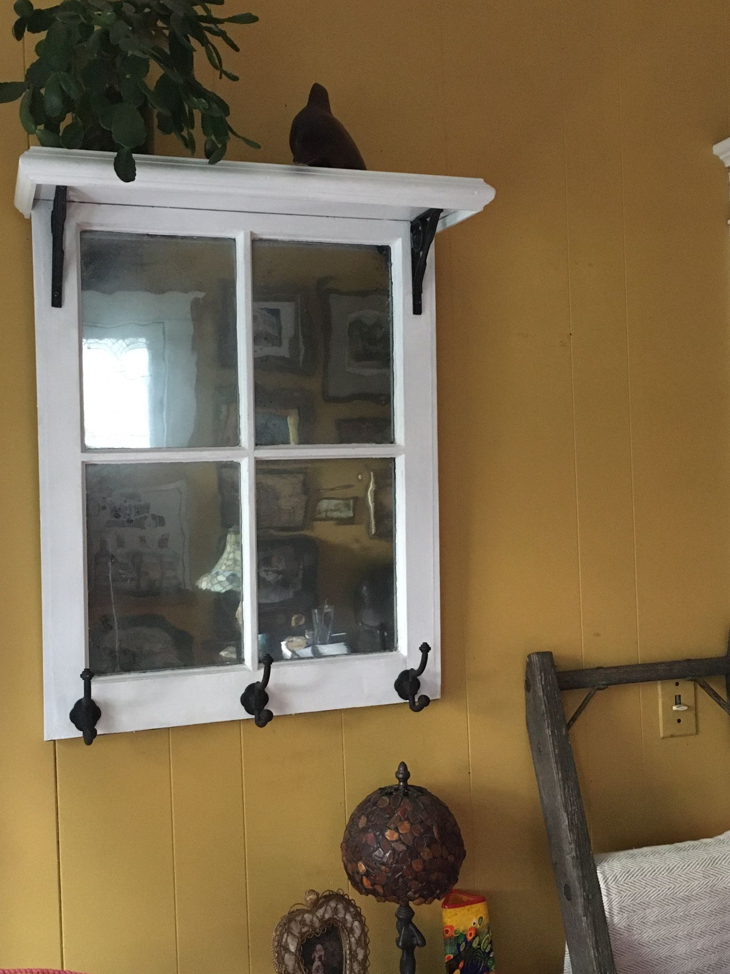Decorative vintage window( glass panes are antique mirrored) with shelf and hooks.