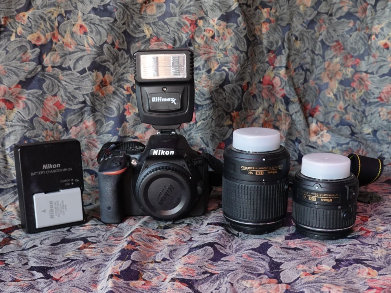 Nikon D5500 DSLR camera w/ Nikkor 18-55mm lens, Nikkor 55-200mm lens, and Ultimax flash