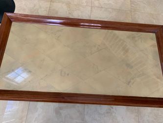 Antique coffee table made with wood and cot skin