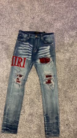 Amiri Distressed Jeans with Red Patches