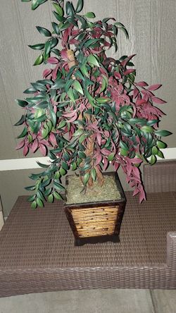 Short artificial plant in a wicker pot
