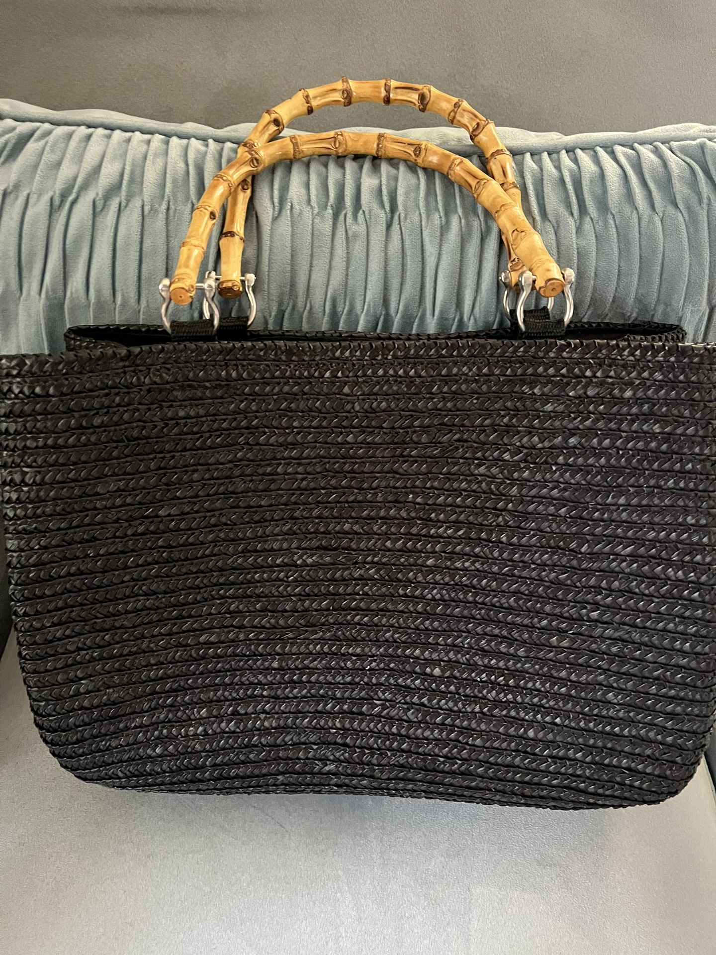 Like new black woven tote bag with bamboo handles. Like new condition!
