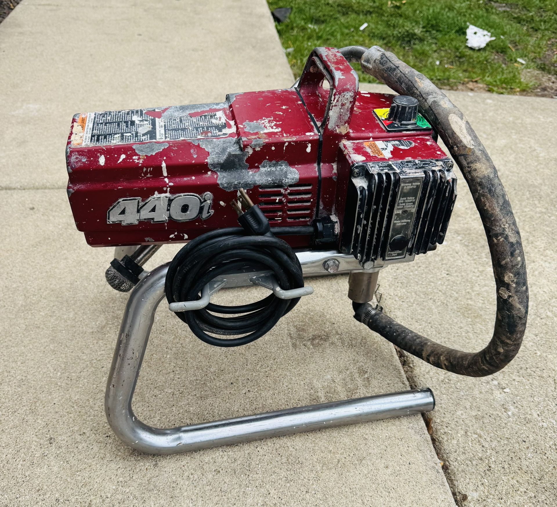 The Titan 440i airless paint sprayer without gun or hose (if available) works well